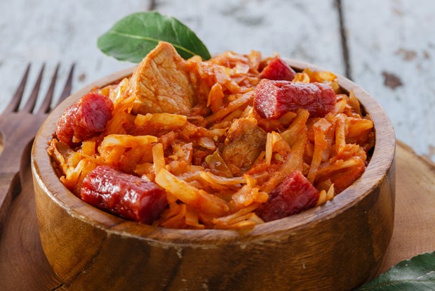 Bigosch is a traditional Polish dish made with sauerkraut, various meats, and spices.