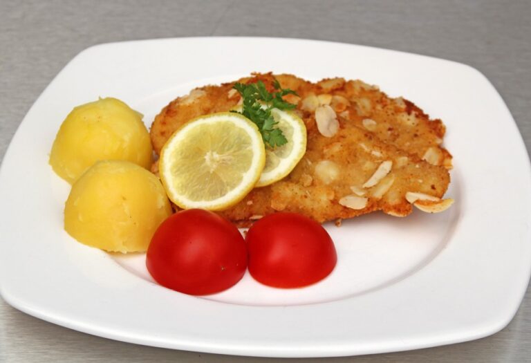 Breaded schnitzel with almond coating - male cooking